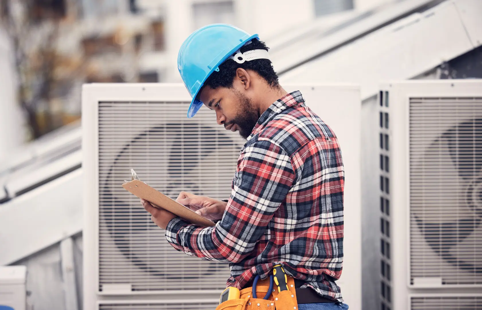 Technician verifying installation checklist